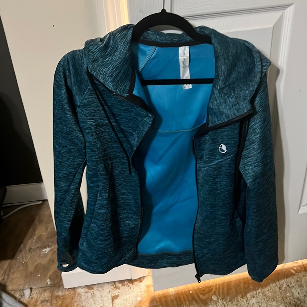 Zip up hoodie size medium, turquoise color with heathered appearance, smooth!